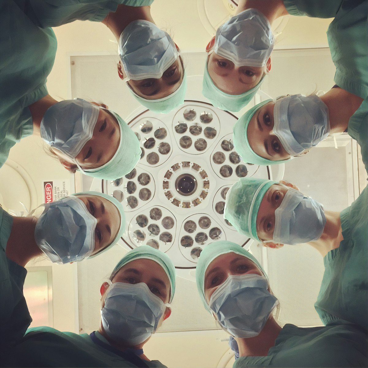 Surgical team working under operating lights